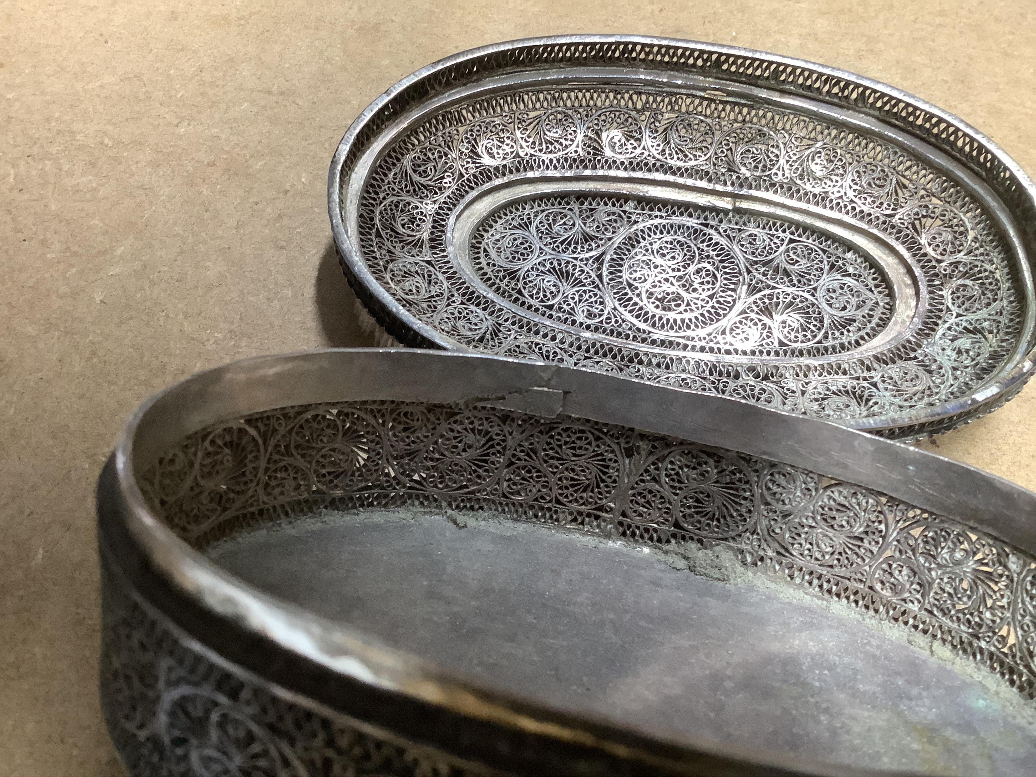 Two Indian filigree white metal boxes, the largest 95mm